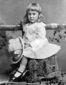 Future US President Franklin Roosevelt in a dress with long hair.